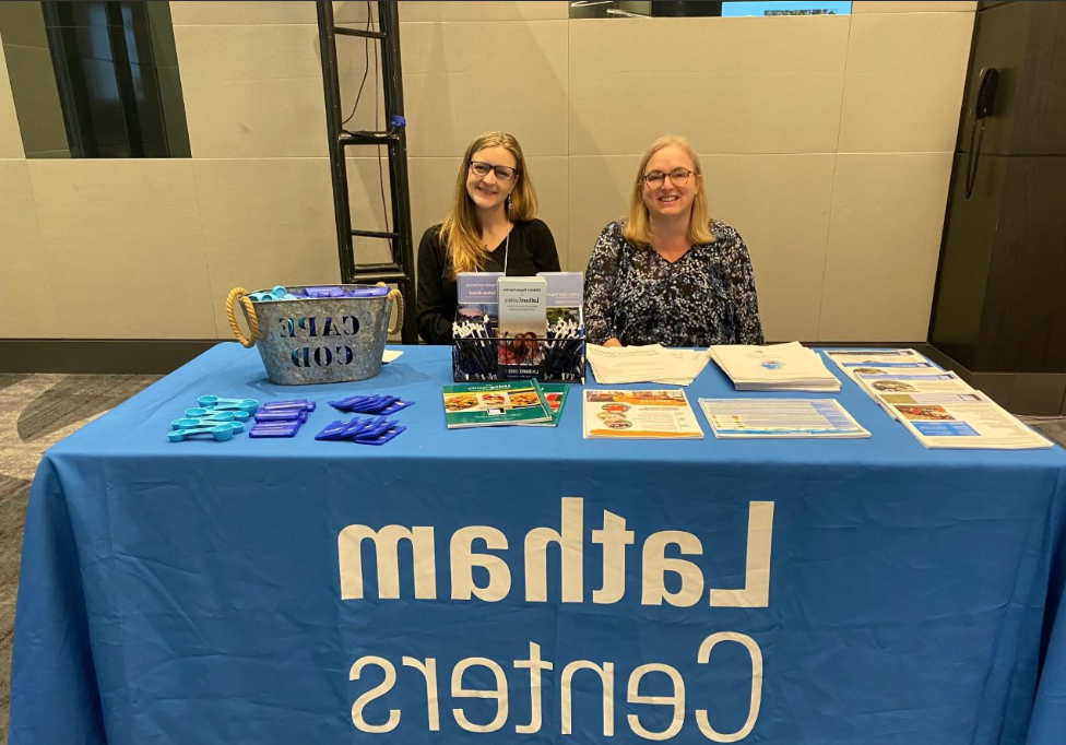 Two staff attend a job fair